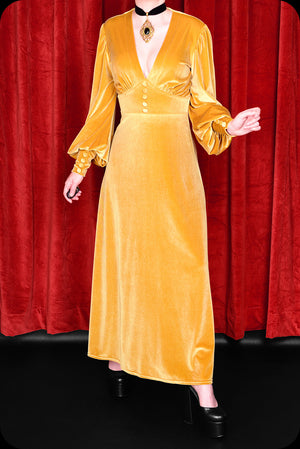 A gold velvet Suspiria maxi dress by Scorpio Rising