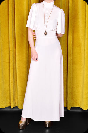 An ivory velvet Morgiana maxi dress by Scorpio Rising