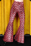 A pair of red leopard print velvet bell bottom trousers by Scorpio Rising