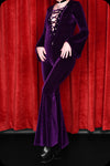 An amethyst velvet lace up Sabbath bell bottom jumpsuit by Scorpio Rising