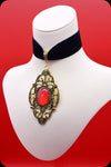 A black velvet antique gold red cabochon choker necklace by Scorpio Rising