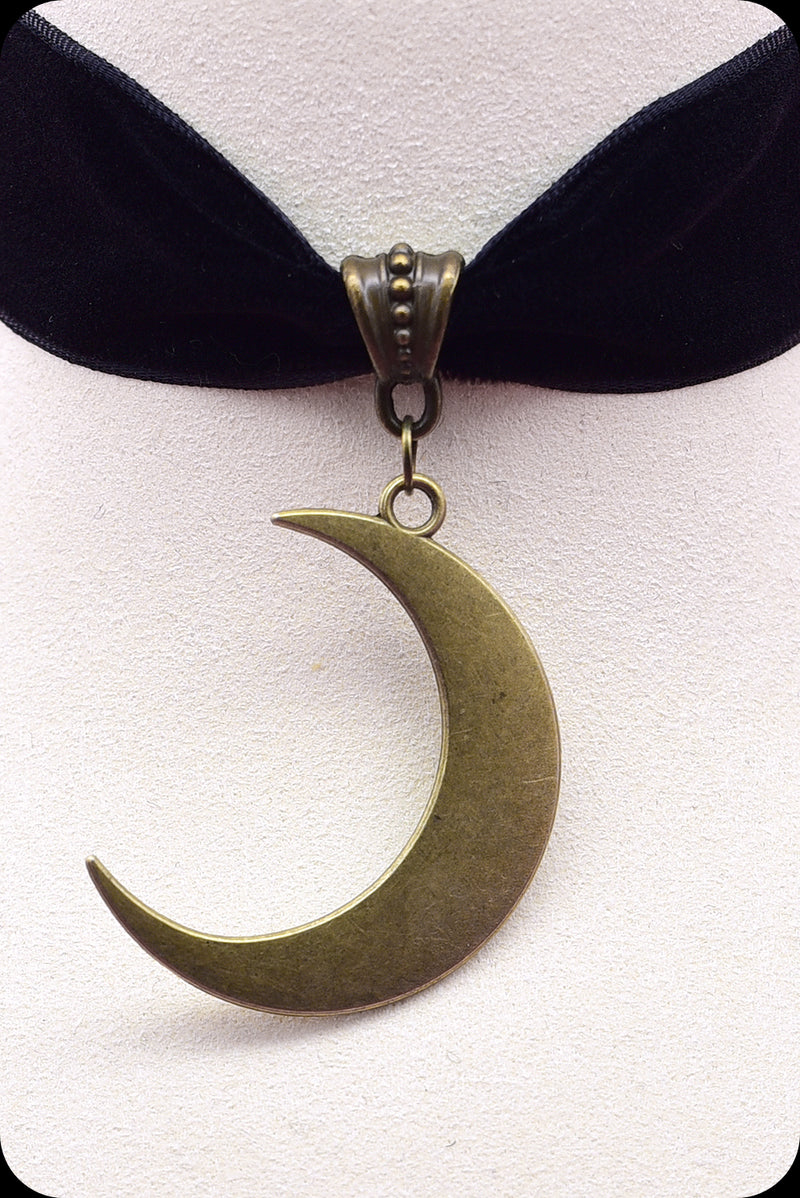 A black velvet antique brass crescent moon choker necklace by Scorpio Rising