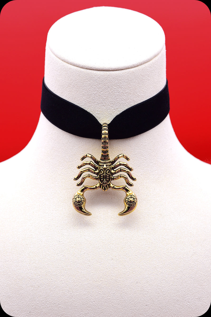 A black velvet antique gold scorpion choker necklace by Scorpio Rising