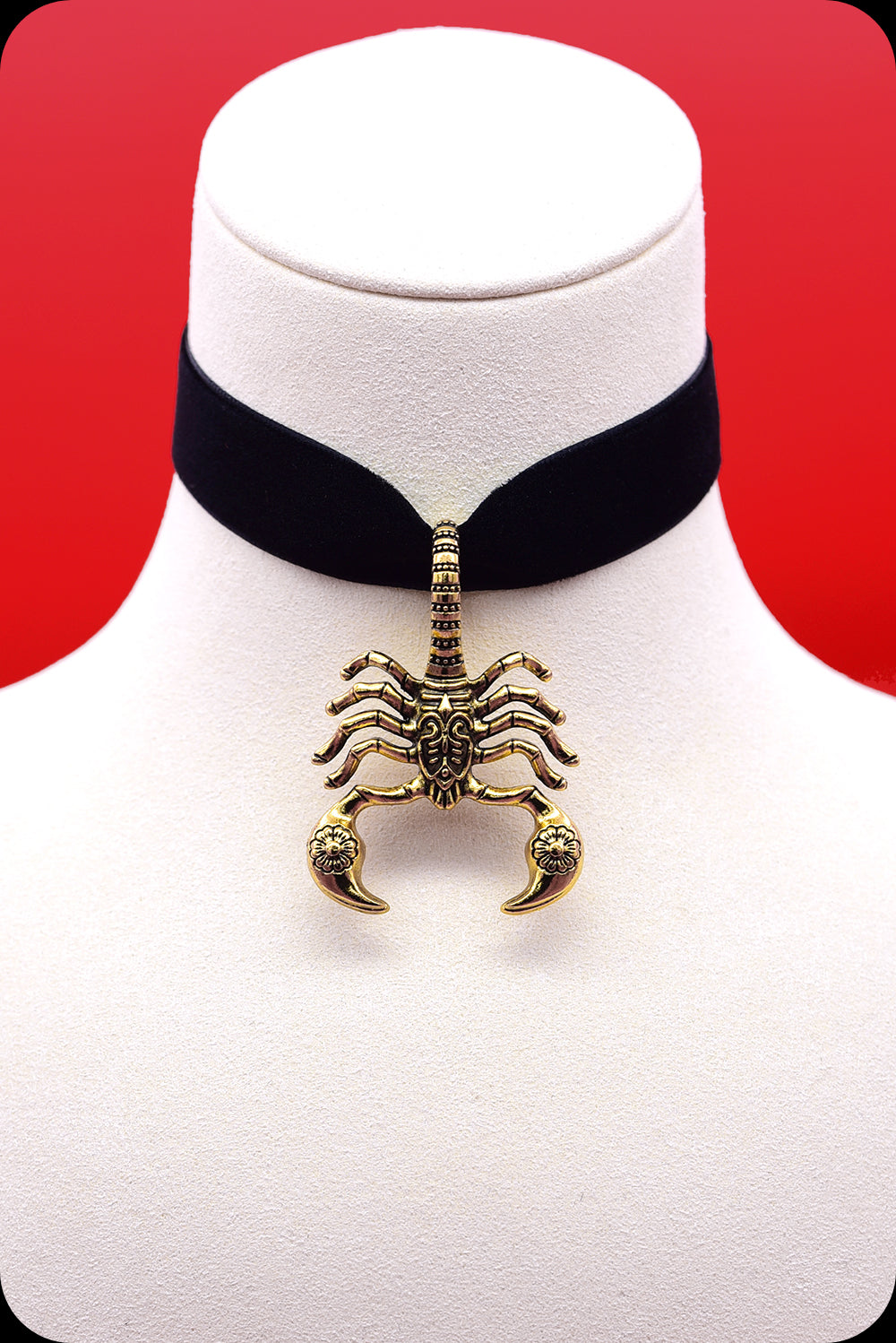 A black velvet antique gold scorpion choker necklace by Scorpio Rising