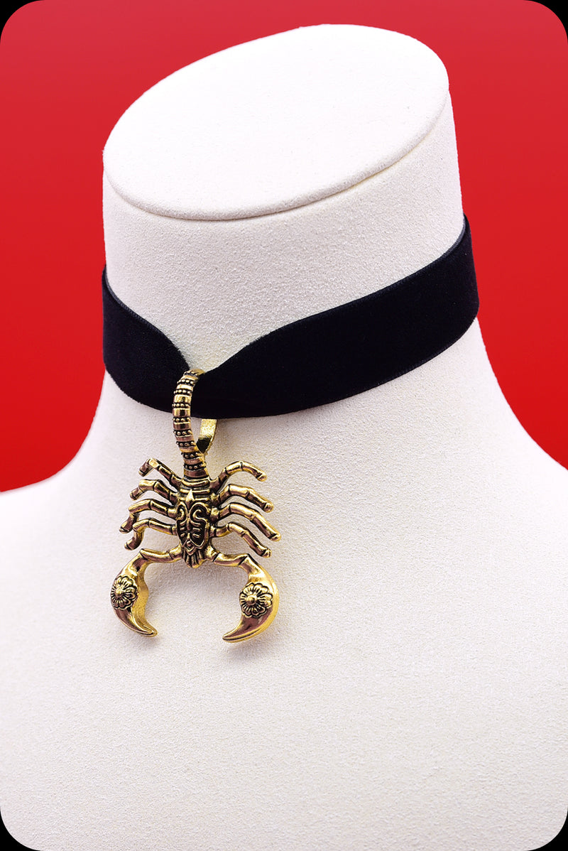 A black velvet antique gold scorpion choker necklace by Scorpio Rising