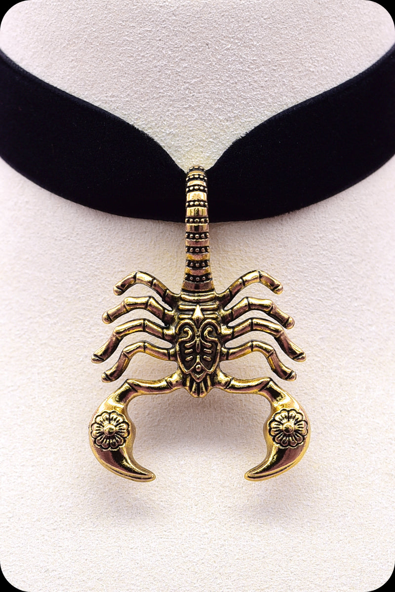 A black velvet antique gold scorpion choker necklace by Scorpio Rising