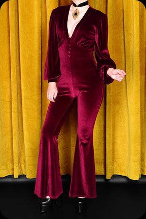 A ruby velvet Suspiria jumpsuit by Scorpio Rising