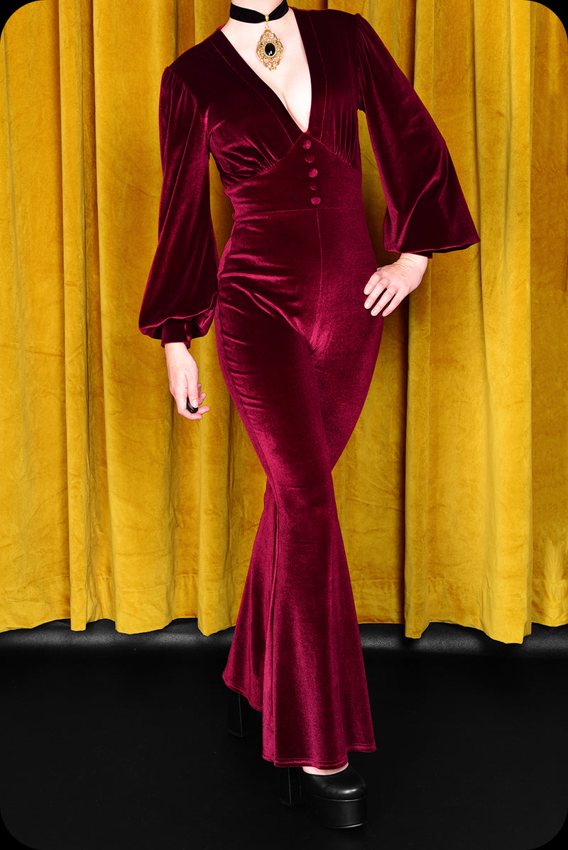 A ruby velvet Suspiria jumpsuit by Scorpio Rising