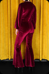 A ruby velvet Suspiria jumpsuit by Scorpio Rising