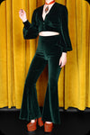 An emerald green velvet Supiria bell bottom co-ord set by Scorpio Rising