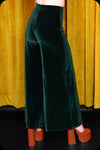 A pair of emerald green velvet wide leg trousers by Scorpio Rising