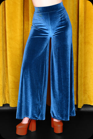 A peacock blue velvet Supiria wide leg co-ord set by Scorpio Rising