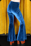 A pair of peacock blue velvet bell bottom trousers by Scorpio Rising