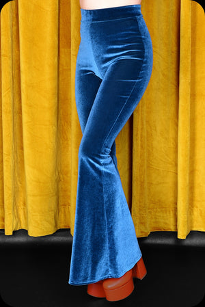 A pair of peacock blue velvet bell bottom trousers by Scorpio Rising