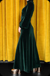 An emerald green velvet Morgiana maxi dress by Scorpio Rising