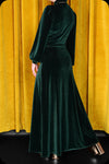 An emerald green velvet Morgiana maxi dress by Scorpio Rising