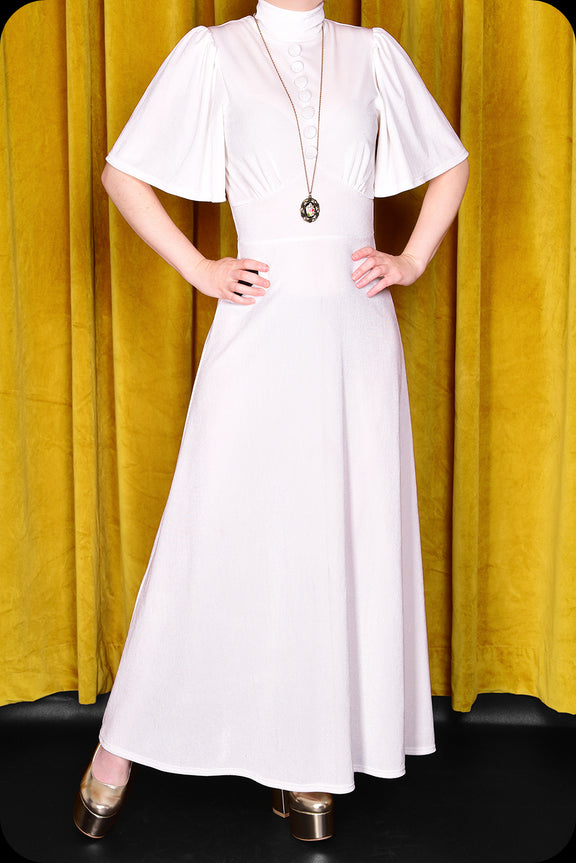 An ivory velvet Morgiana maxi dress by Scorpio Rising